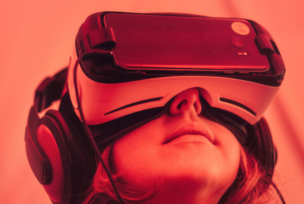 Person wearing VR headset and headphones